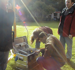 Students setting up a surface - atmosphere exchange measurement system on the lawn at the university in preparation for urban measurements