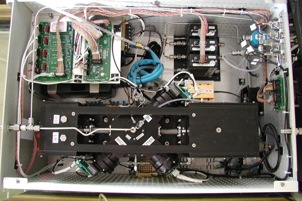 View of the internal components of the SP2, with electronics (top left), flow control (top right) and optical block (bottom) visible.