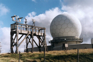 View of the Great Dun Fell site, showing the measurement platform and some instrumentation, with the Civil Aviation radar building in the background.
