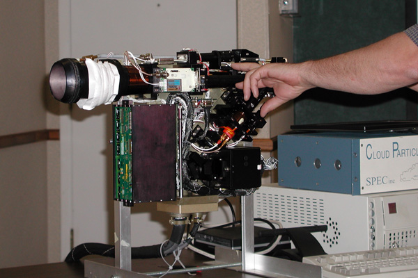 Cloud Particle Imager undergoing calibration with certified size standards.